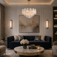 Marble wall lights on a traditional sitting room wall with stunning chandelier to complement the lighting in the room.