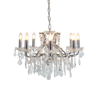 Chrome shallow 8-arm crystal chandelier with faceted crystal droplets.