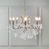 Chrome shallow 8-arm crystal chandelier with faceted crystal droplets.