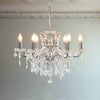 Shallow chrome 6-branch crystal chandelier with crystal droplets.