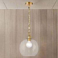 Clear glass pendant light with decorative gilt brass chain hanging from ceiling