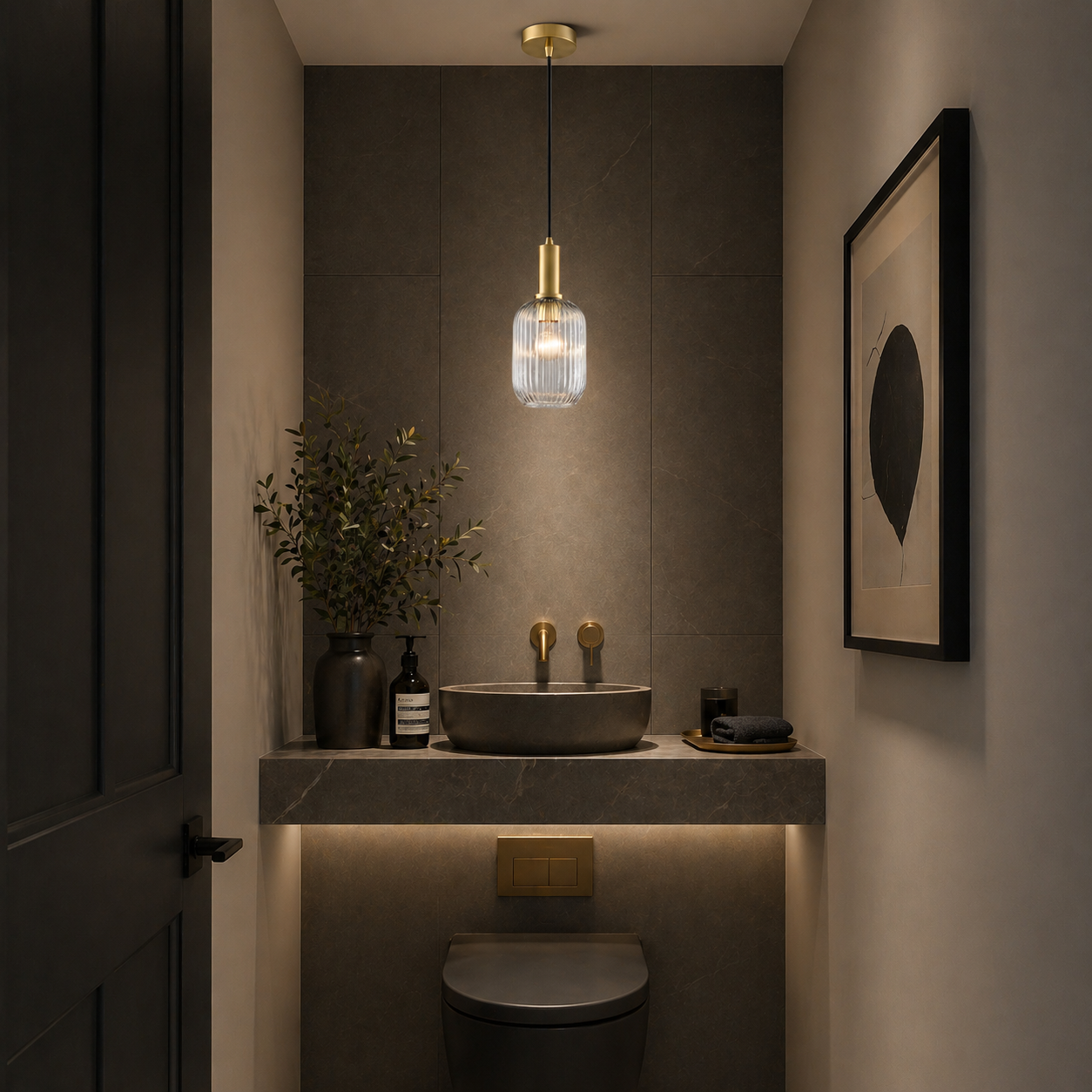 Clear glass, long ribbed pendant in a grey modern cloakroom. 