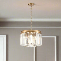 Compact 40 cm chandelier with a brushed gold band and hanging prism-cut crystals, suspended from an adjustable gold chain.