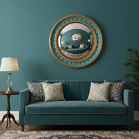 Convex mirror above a sofa in a teal coloured room with teal sofa n a traditional sitting room. 