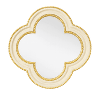 Small quatrefoil mirror with a luxurious gold beaded border