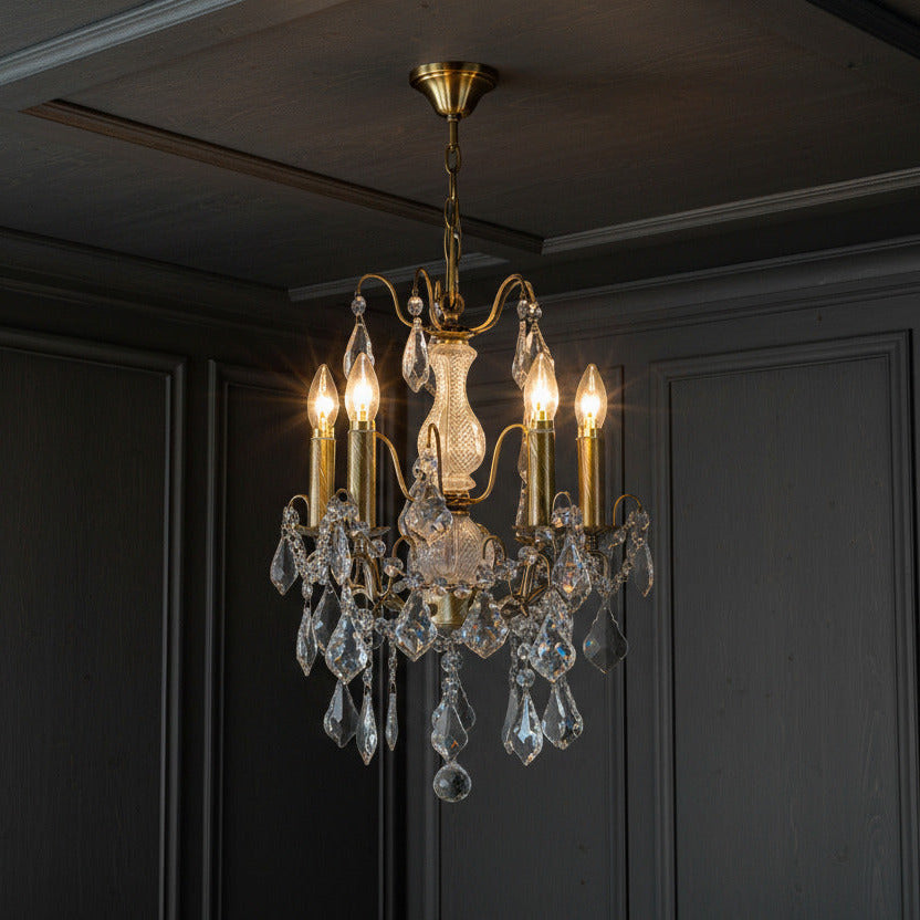French gold five-arm crystal chandelier with faceted crystal droplets in living room
