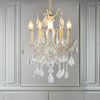 French white five-arm crystal chandelier with faceted crystal droplets in living room