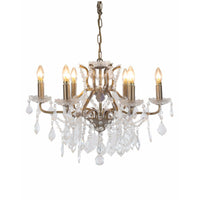Gold six-arm shallow crystal chandelier with faceted crystal drops.
