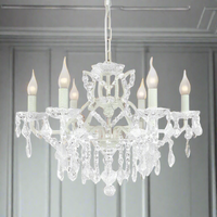 White six-arm shallow crystal chandelier with faceted crystal drops