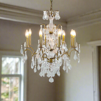 Stunning classic shaped chandelier smothered in crystal drops on a gold metal base. The classic, longer 8 arm chandelier in gold with a mass of crystal drops. A perfect hall or bedroom chandelier for a period home.