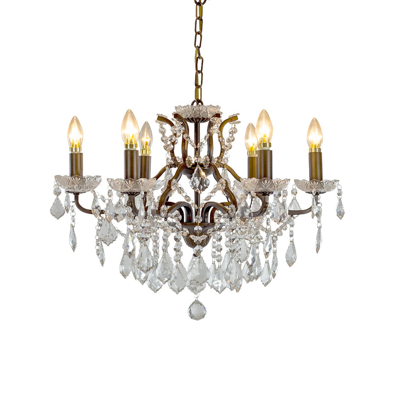 Six-arm bronze chandelier with crystal droplets and candle-style bulbs, hanging from a bronze chain.