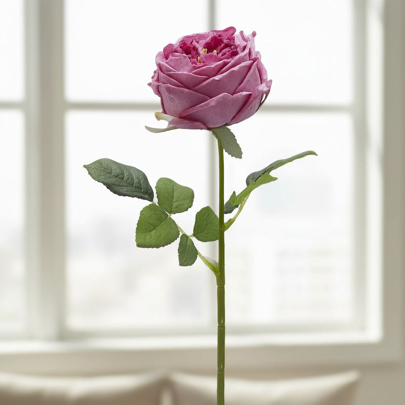 This ultra-realistic artificial dark pink rose features rich, velvet-like petals and a vibrant green stem with textured leaves.