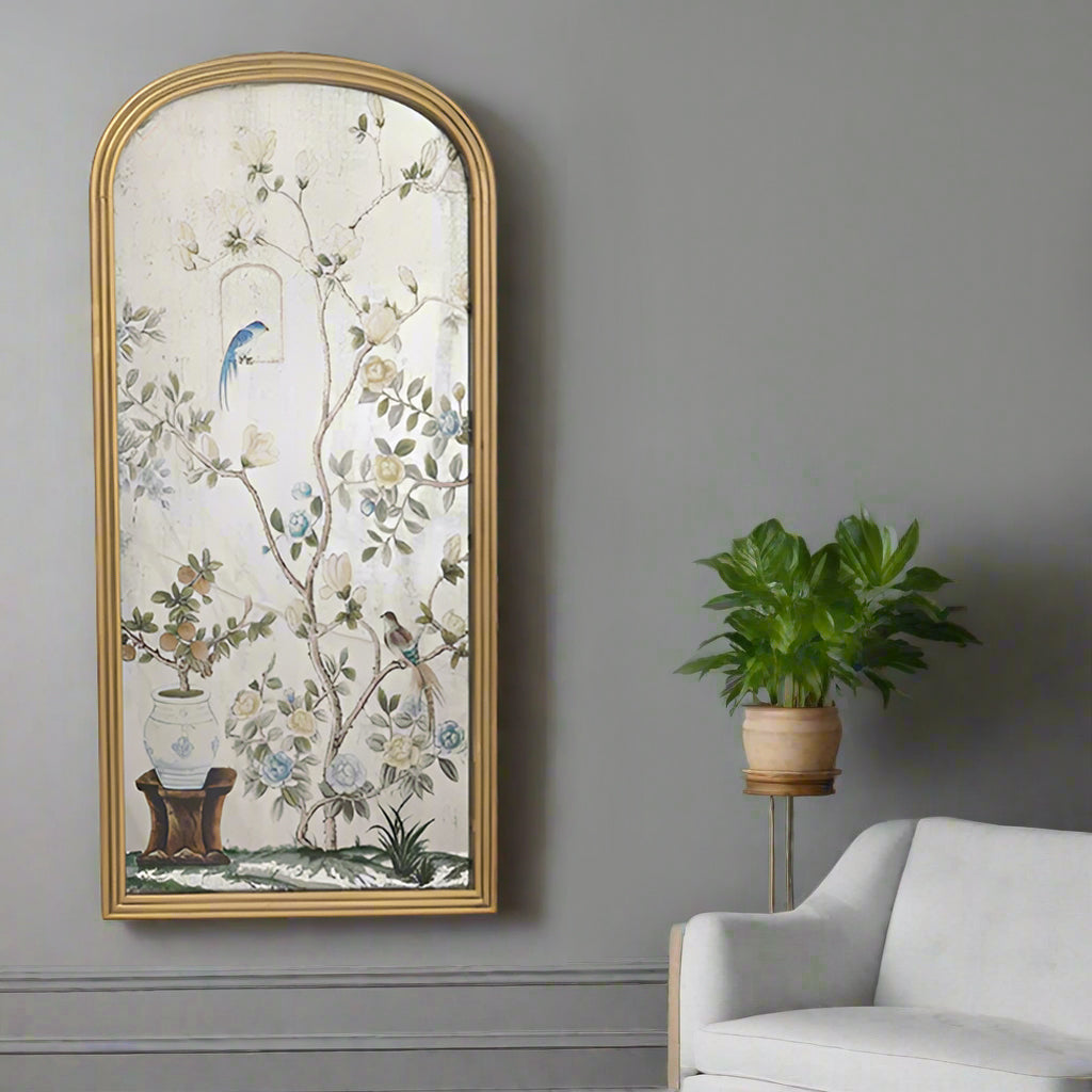 A stunning piece of mirrored wall art, a classic bird and flowers 'Victorian' style image on an arched mirror. The reflective surface creates a light enhancing focal point.