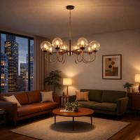 Modern living room with a chandelier, couches, and cityscape view.