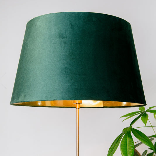 Green lampshade with gold interior on a white background
