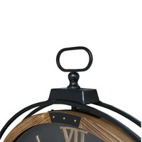 Wall clock with moving cogs and an antiqued black face. Black metal & wooden rim A great moving clock, large enough to be a real statement. 