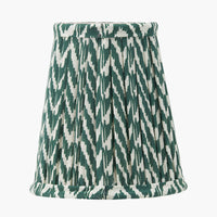 Tapered green and white pleated lampshade with classic candle clip fitting and hand-finished trim.