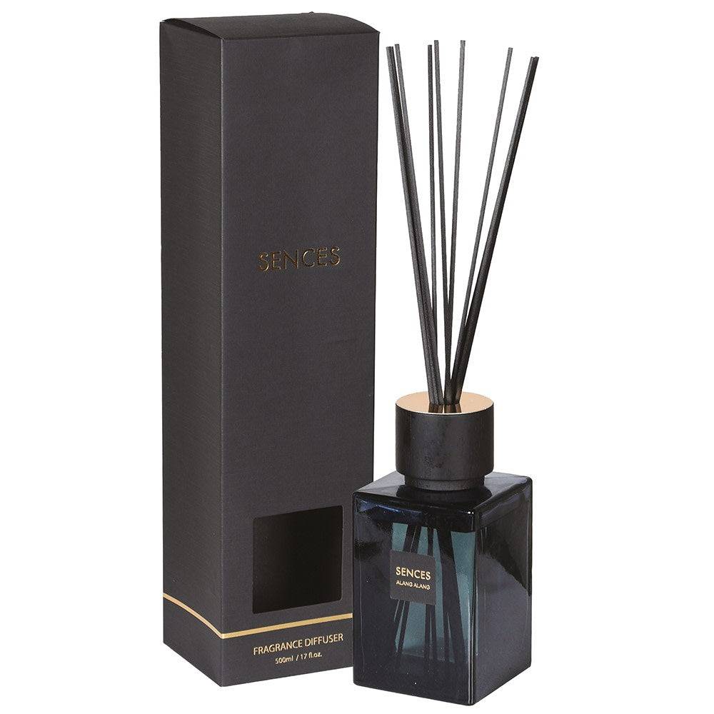 Black fragrance diffuser with reeds and packaging on a white background