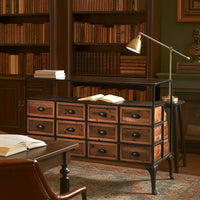 Wooden display cabinet with drawers and bookshelves filled with books in a room setting.
