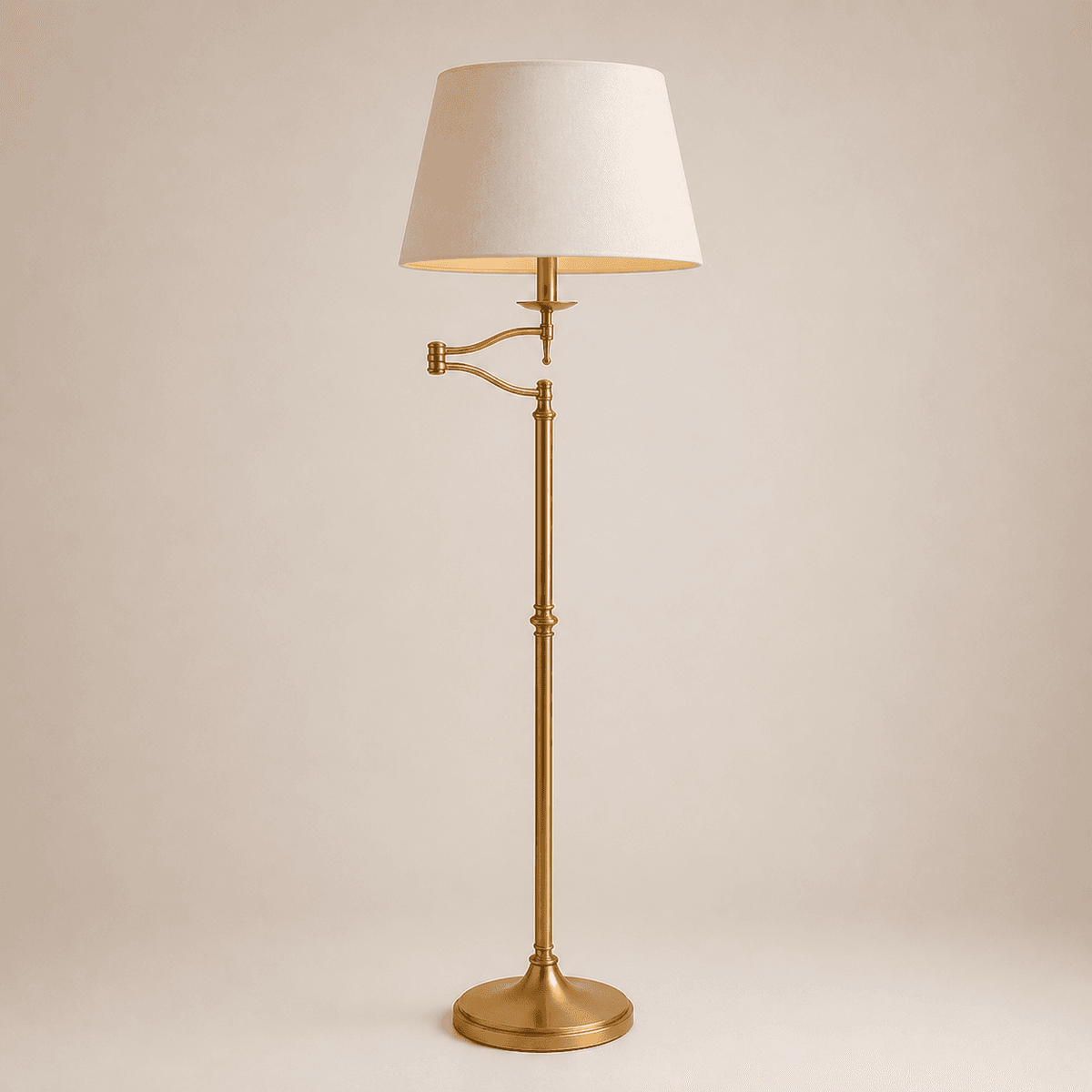 Brass extending arm floor lamp with adjustable swing arm and beige lampshade