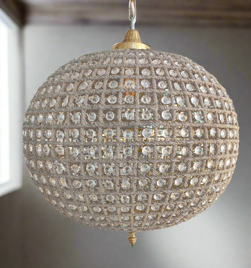 Extra large brass crystal globe chandelier with crystal beading encased in brass metalwork that reflects a pretty pattern around your ceiling and walls. A classic and glamorous ceiling light which compliments all types of decor. 