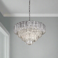 Four-tier extra-large crystal chandelier with clear tubular glass rods and polished metal frame.