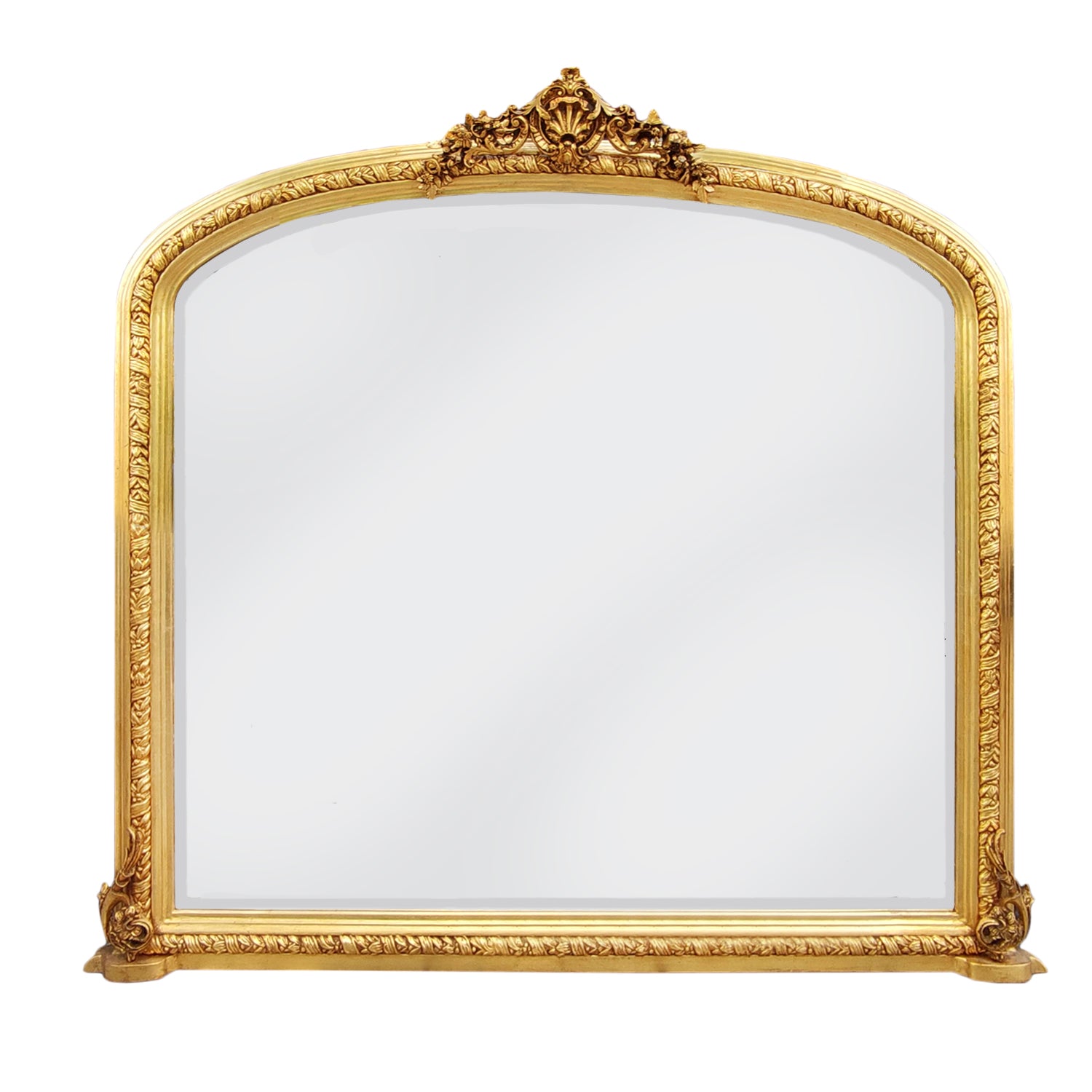 Ornate gilt overmantle mirror with a lavish gold leaf frame, decorative Rococo crest, and intricate baroque scrollwork .