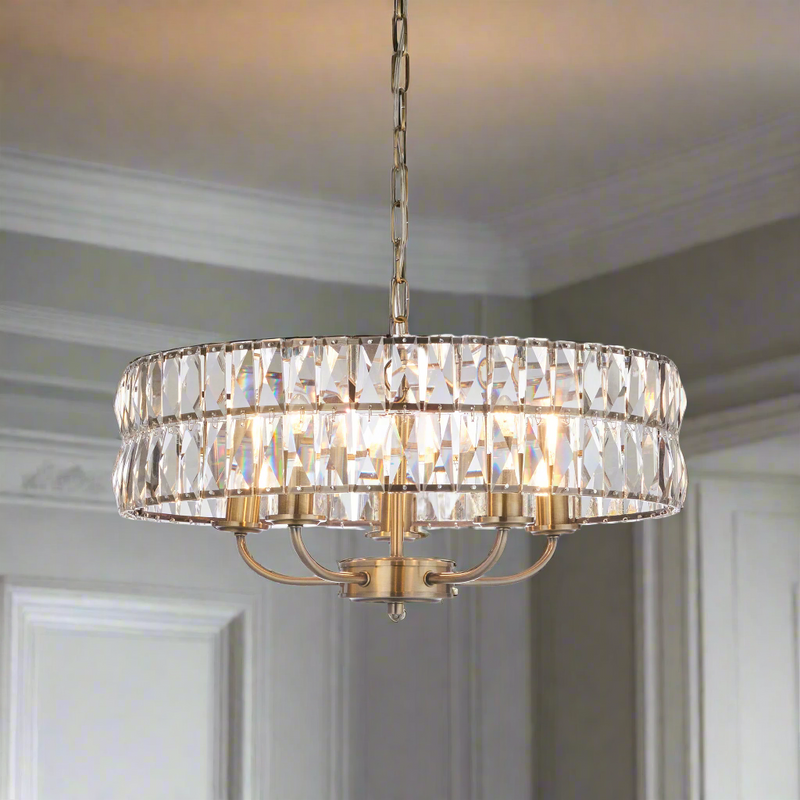 Gilt metal banded faceted, cut glass chandelier with 5 lights. Perfect sitting room or bedroom light, will add warmth and elegance to any room.&nbsp;