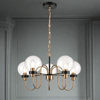 Five Clear glass globes on the five metal arms in antique gold on matte black, a stunning medium size statement light. Adjustable chain offers a long drop for this fitting. An extremely unusual fitting, suitable for a study, bedroom or smaller living room.
