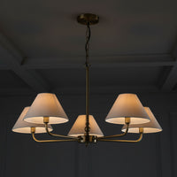 Chandelier with five lampshades on a white background