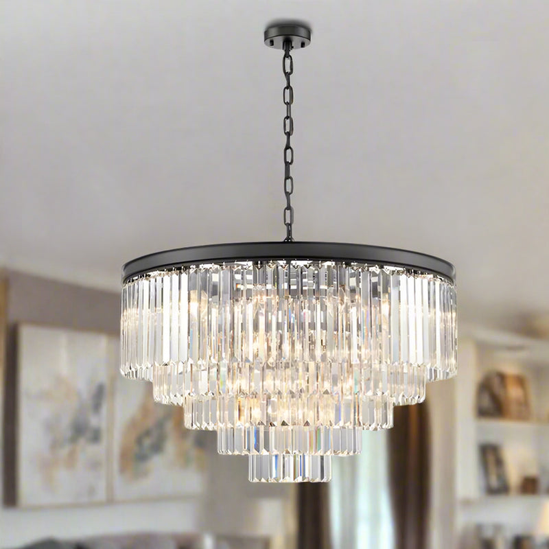 This five-tier chandelier brings timeless glamour and modern elegance together in one striking centerpiece. Its sleek black band frames cascading layers of crystal prisms