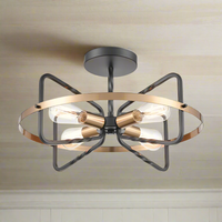 Black and gilt metal ribbon style semi-flush pendant, stylish design with 4 filament bulbs. Black chain and ceiling rose. This comes on a longer chain or flush to the ceiling. Exceptional design and quality, an impressive alternative for a low ceiling.&nbsp; Perfect in a hall, stairwell or entryway.&nbsp;&nbsp; A stylish addition to a living room or hanging over a contemporary dining table.

H: 31 cm (Min) 140 cm (max) W: 52 cm