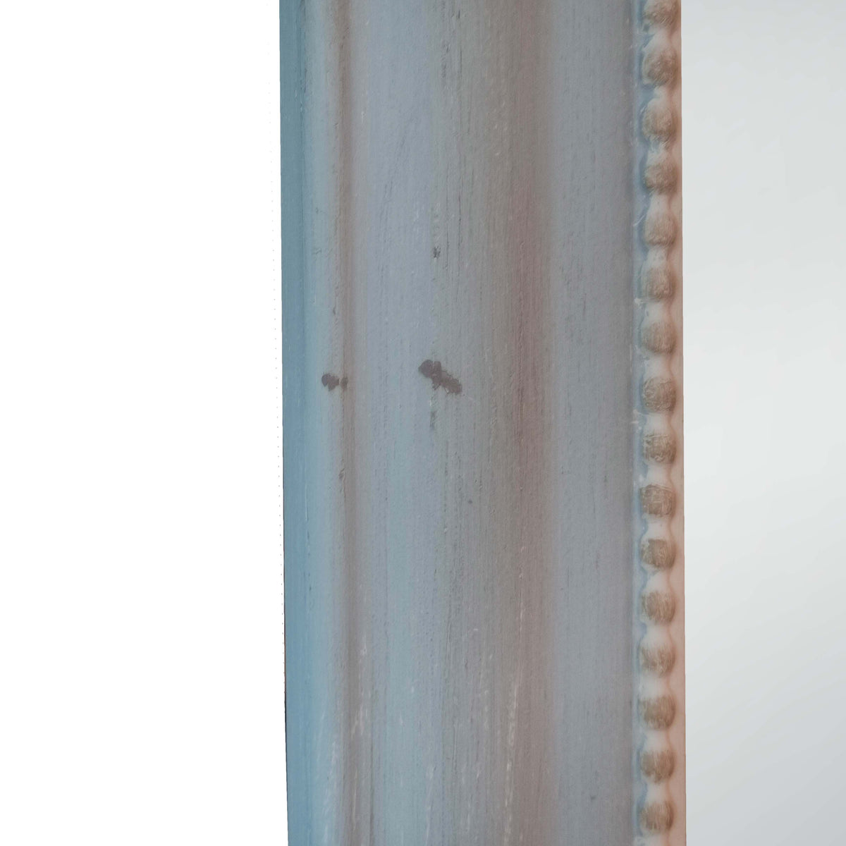 detail of the distressed frame of the cheval mirror
