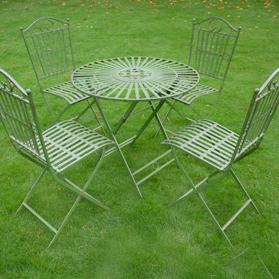 Foldable five piece garden bistro set in a light green. With an antique and vintage aesthetic this set would be a focal point in a garden, patio, or balcony. It adds visual interest and creates a charming spot to enjoy the outdoors. The unique look of this garden set will create a charming and functional outdoor space to enjoy al fresco dining.