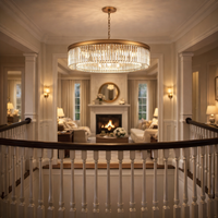 Luxury gilt prism chandelier hanging in a galleried space overlooking a luxury sitting room
