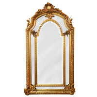 "Ornate antique-style gold gilt mirror with detailed cherub accents, arched central glass, and decorative beveled panel sides, featuring baroque floral carvings and a luxurious rococo frame."