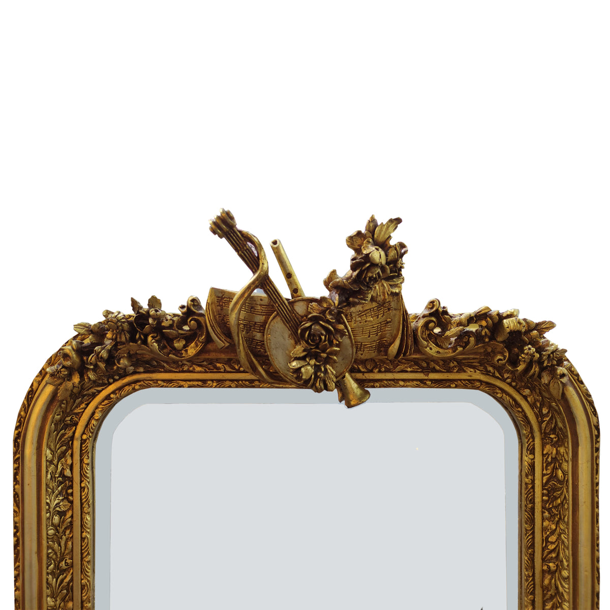 Ornate Gilt mirror with musical instrument decor on white bakground.