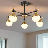Five light gilt and opaque glass globe semi flush ceiling light in black and gold finish