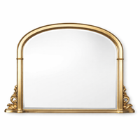 arched overmantle mirror which has a width of 127 cm beautifully framed in antique gold with rich scrollwork detailing at the base has a timeless design which draws inspiration from 19th-century French architecture