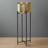 A very tall glamorous gold metal plant stand on tall slender black iron legs which will brighten and lift your patio or garden area. The gold metal plant pot is a useful 30cm diameter and the plant stand finishes at 94cm tall lending elegance and stature to any greenery, foliage or flowers you choose to plant in it. 