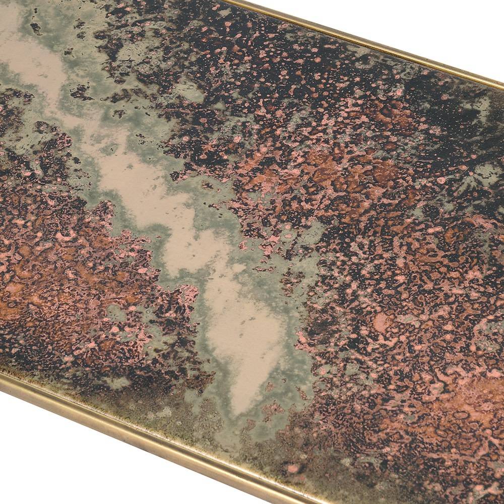 Glass topped console table  with lower oxidised metal shelf. The effect of the lower shelf has a rich patina of deep bronzes,reds and greens adding a time-worn aesthetic.
