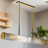 Long glass tubular, linear light, set on two gilt bars and a gilt coloured roof plate. The ends of the long bar are enclosed by two round gilt discs. Great Island light.