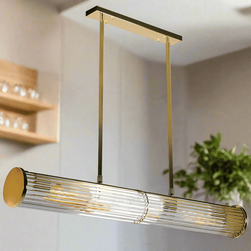 Long glass tubular, linear light, set on two gilt bars and a gilt coloured roof plate. The ends of the long bar are enclosed by two round gilt discs. Great Island light.