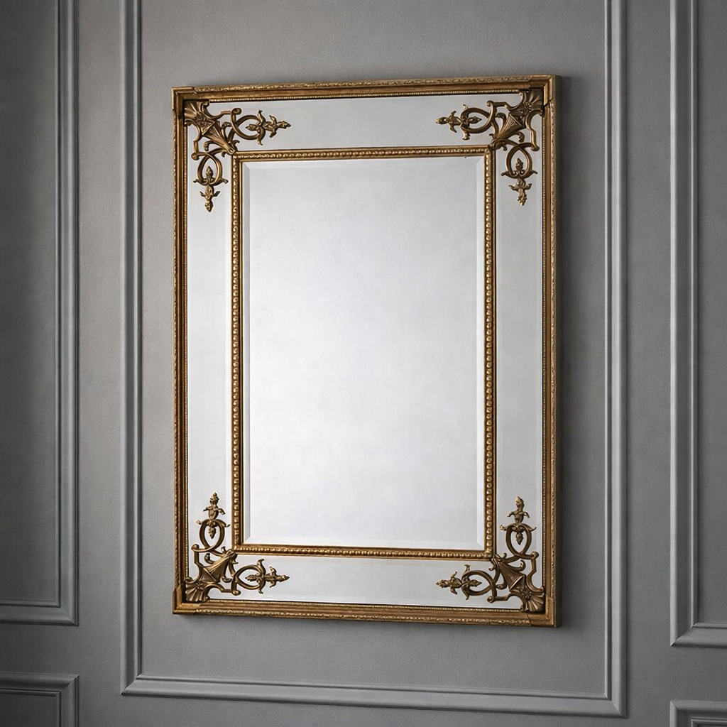 Ornate gilt mirror on a grey paneled wall, simple, neutral background.