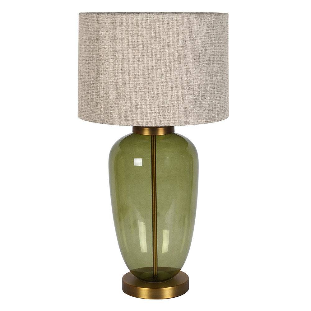 A table lamp with a textured beige linen drum shade, a glossy olive green glass vase-shaped base, and a gold-finished metal collar and circular base, shown against a plain white background.