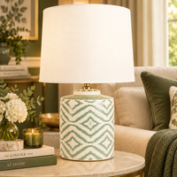 green & white ceramic table lamp in a living room