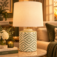 green & white ceramic table lamp in a living room