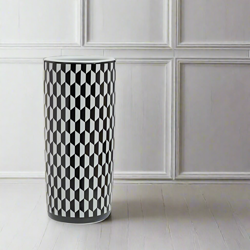 A stunning chequer designed black and white ceramic umbrella stand.&nbsp; A beautiful addition to your hall. The outstanding black and white chequered pattern is definitely going to stand out in any hall, foyer or entryway. Superb umbrella storage in a glamorous ceramic stand. A striking visual contrast in any neutral painted room.&nbsp; Crafted from high quality ceramic, the umbrella stand has a smooth, glossy finish to enhance the crispness of the design while the cylindrical shape offes ample space for m