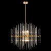 Large gold chandelier with tall staggered clear glass rods and a central 10-light design, suspended from a gold rod.