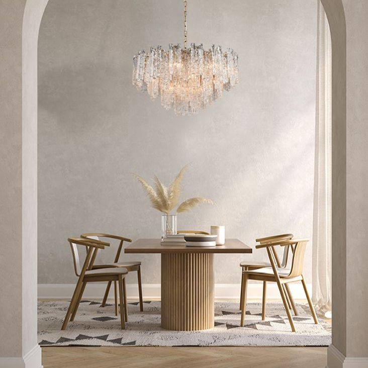 Icicle shard chandelier with textured glass panels at varying heights to refract the lights.  An extra large chandelier for the utmost impact, over a large dining table or as a total statement in your living area.